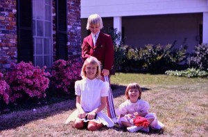Easter photo with me, the oldest sitting, my brother and my younger sister.
