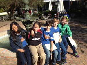 Students pose at the outdoor fountain.