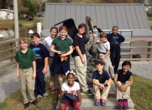 students at Pelican sculpture