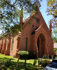 Church of the Epiphany is surrounded by waving palms.