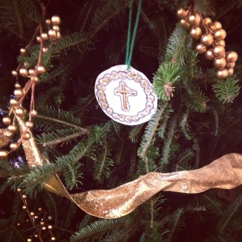 Chrismons decorate a large fir tree in our church.  