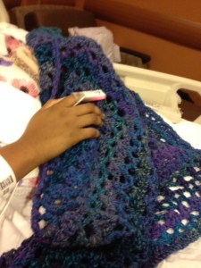 A picture of Glenae holding the prayer shawl I made for her when she was in the hospital.