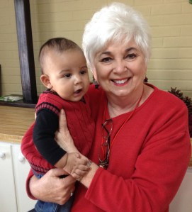 Solomon House volunteer, Betty, holds precious Melachi.