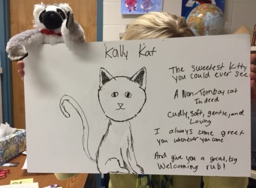 Emily illustrated her poem and took a picture of me and Jack (the lemur) holding it up.  