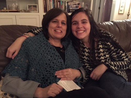 Stacey wrapped in the prayer shawl and her daughter, Erin.  