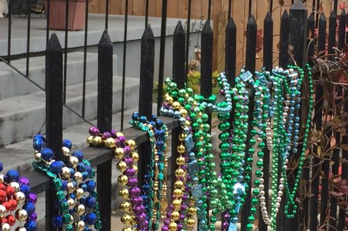 Many people decorate fences and trees with beads.