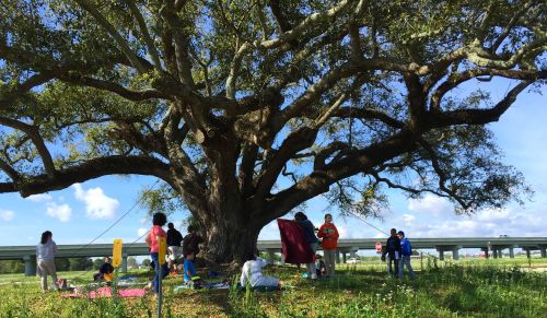 Mr. Al surrounded by children.