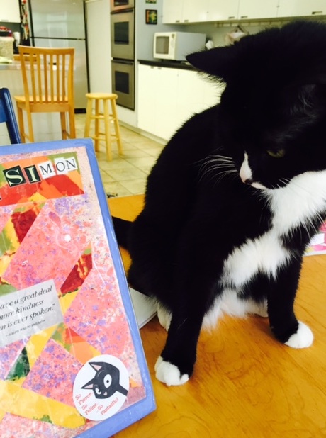 Fierce feline sticker on my journal with my fierce feline, Mimi. 