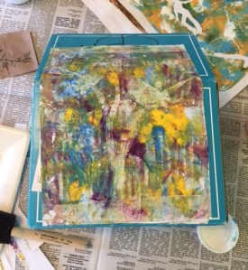 Step one: Cover the box with decorated paper. I like the way Modge Podge paints on so you have fewer wrinkles.