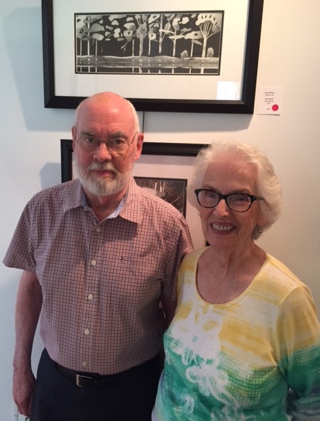 My parents, Dot and John Gibson with Dad's art. 