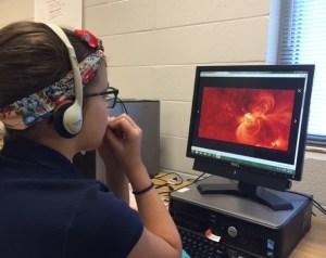 Lani watches a video about solar storms on Wonderopolis. 